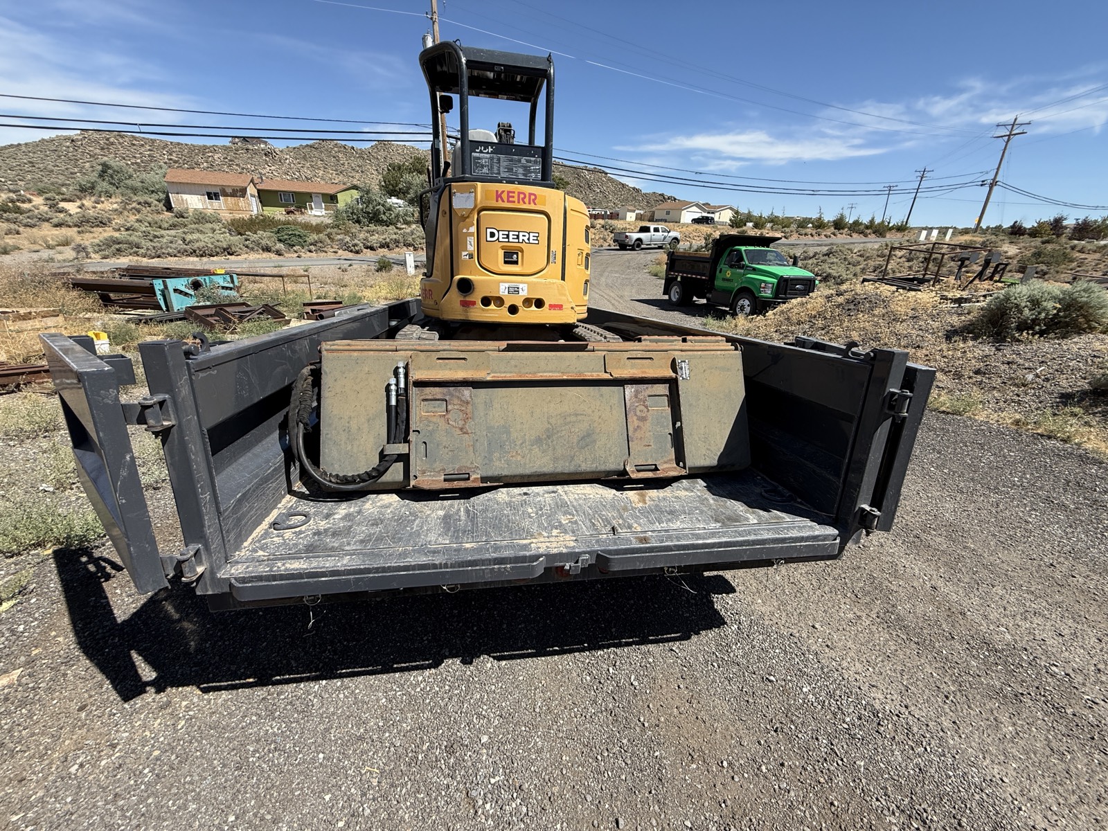 John Deere mini excavator loaded for transport in the high Sierra near Truckee, Errol Kerr excavation equipment