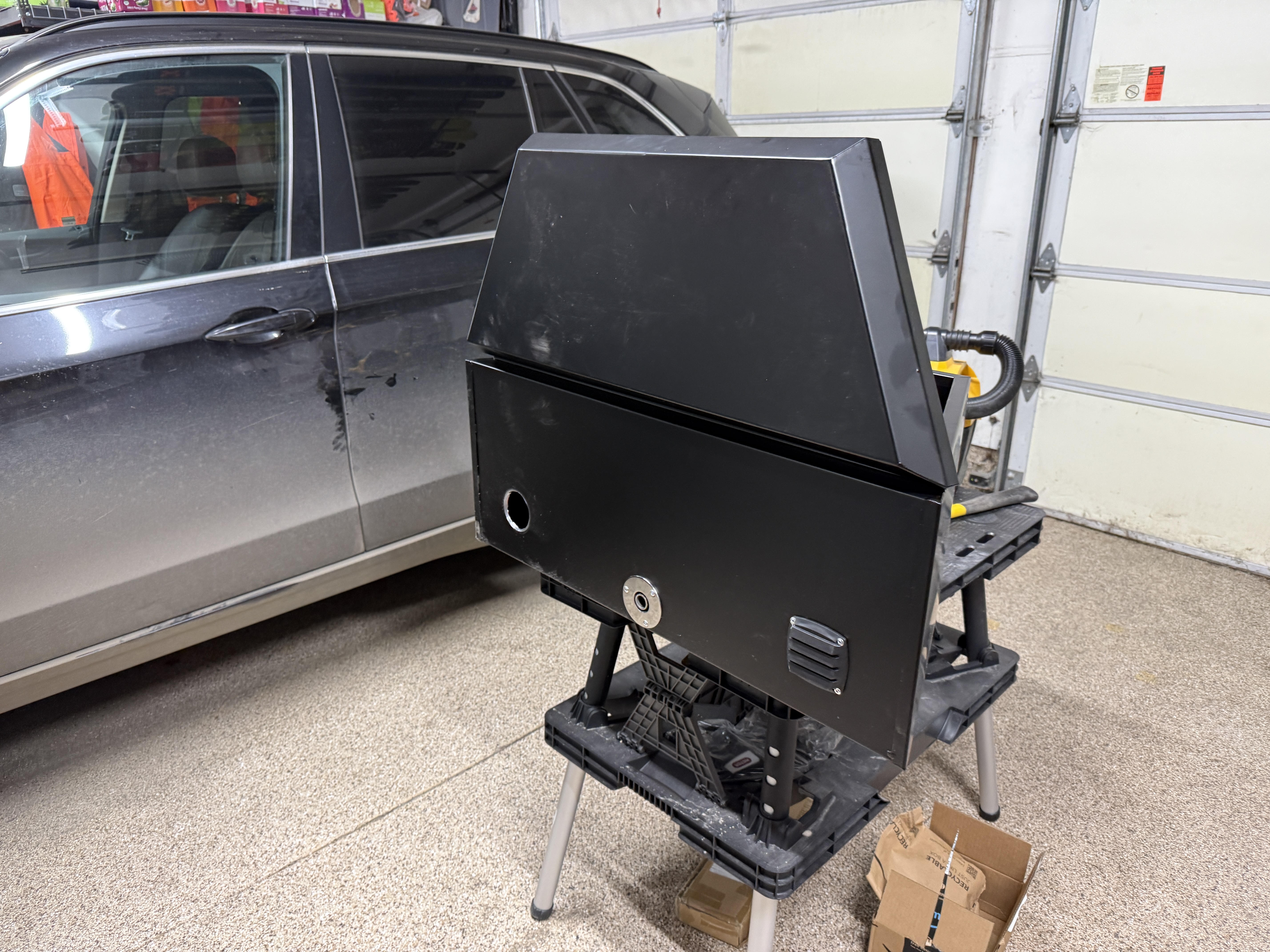 Full tongue box enclosure on sawhorses in garage
