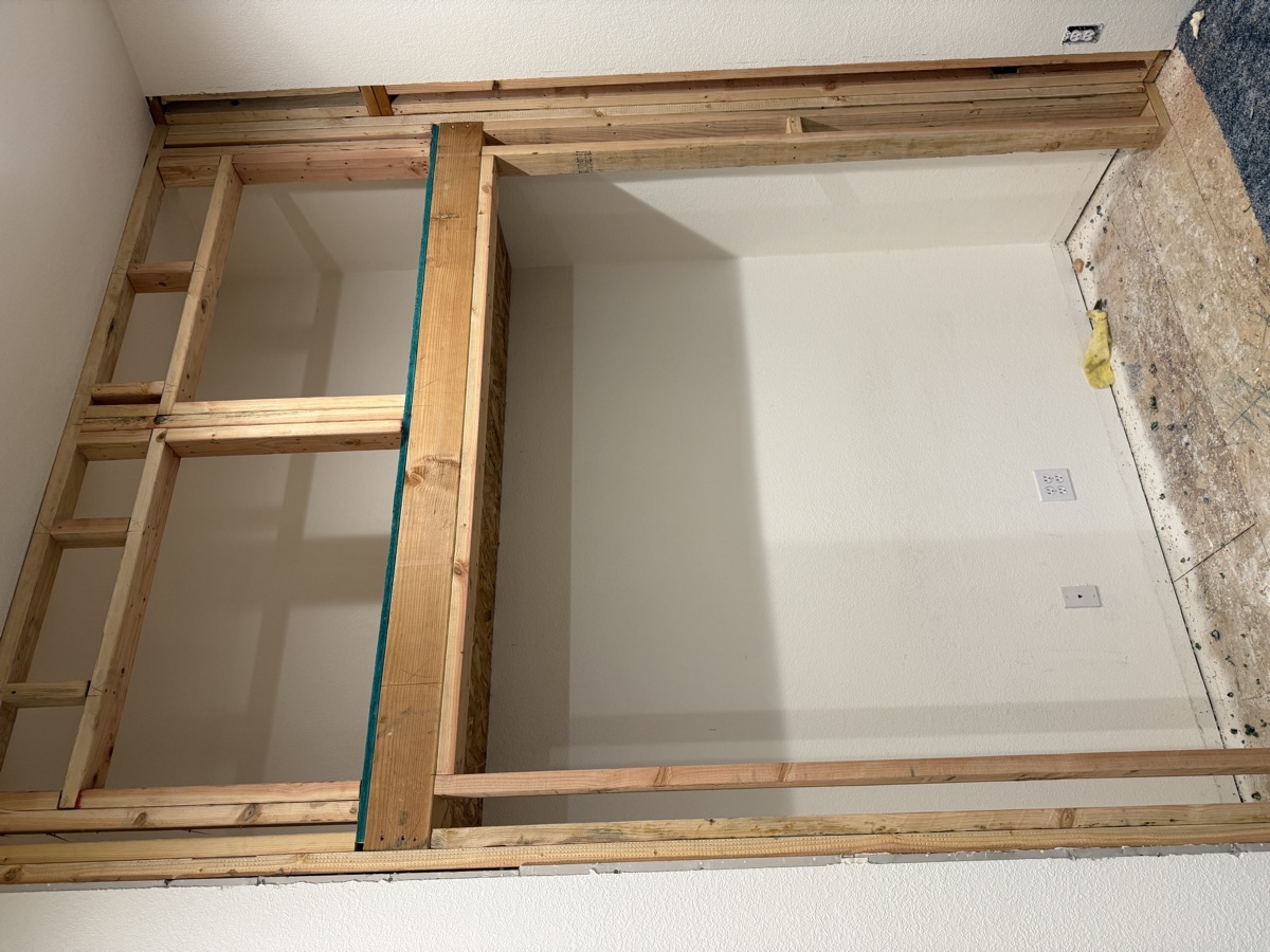 Framed closet header and upper cubbies