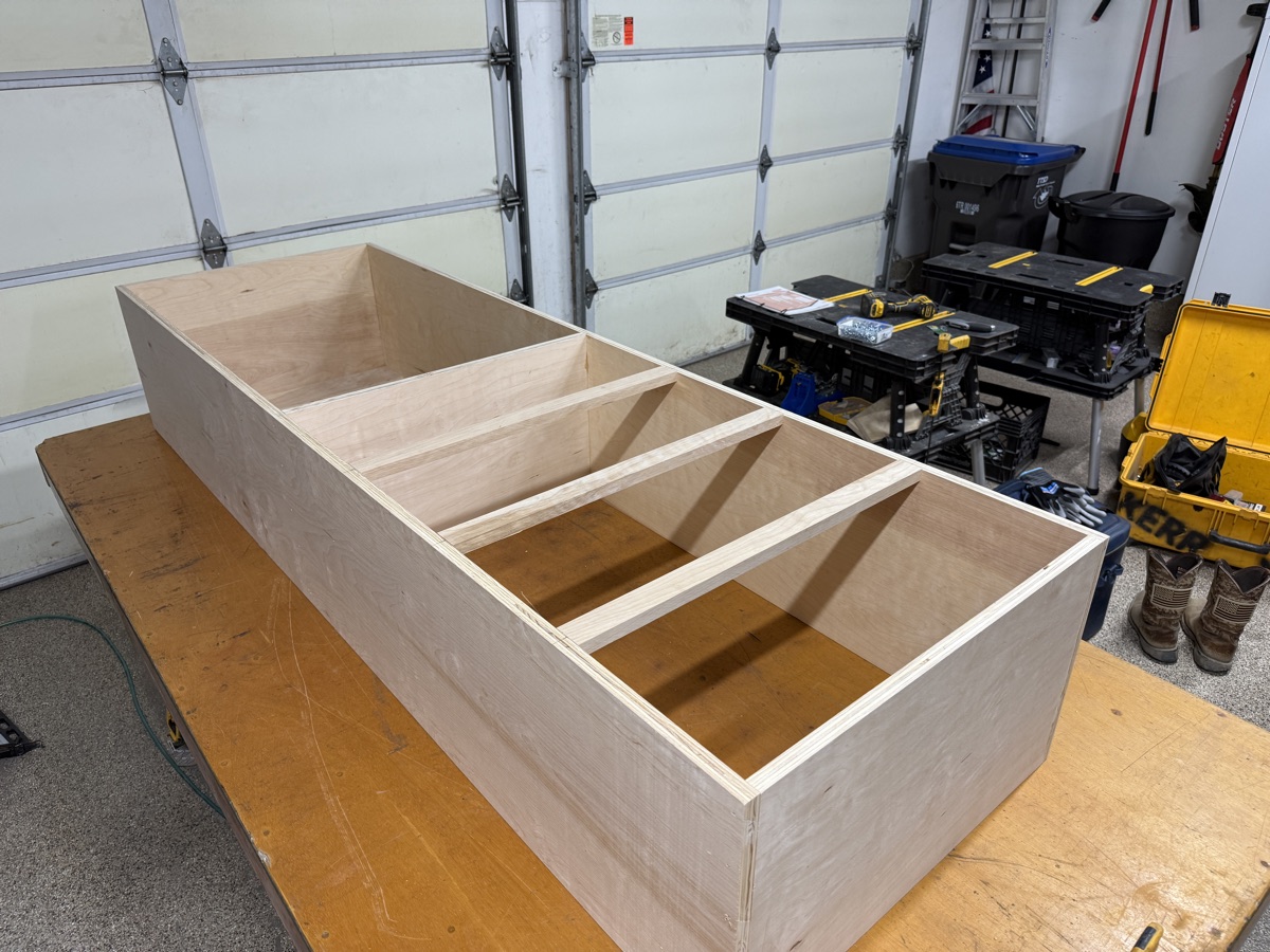 Cabinet-grade plywood shelving tower with dividers built in the shop