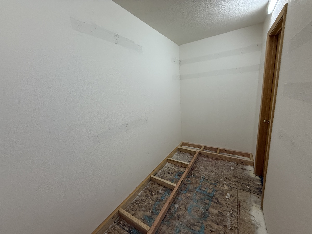 Drywalled closet interior ready for the built-ins