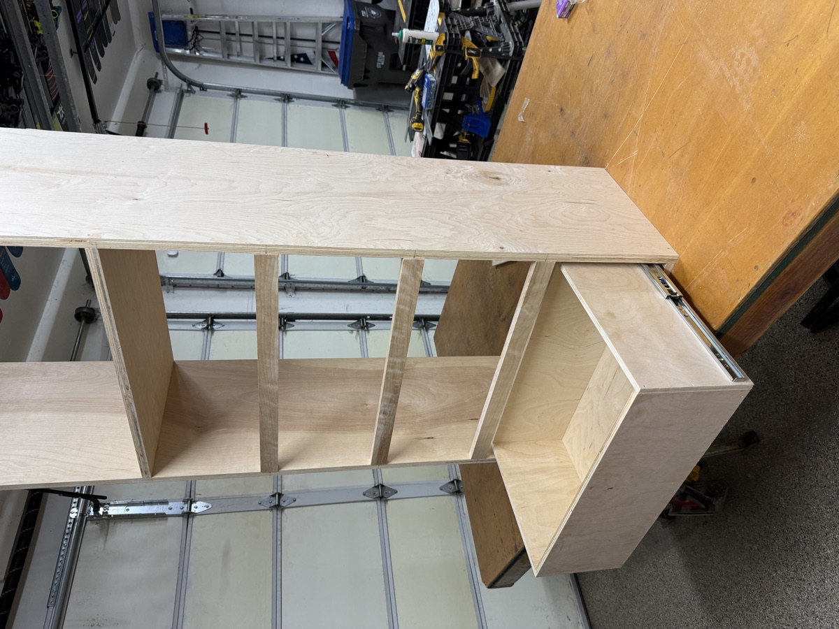Shelving tower with a soft-close drawer on full-extension slides