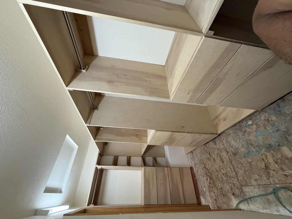 Close-up of completed closet shelving towers with adjustable shelves