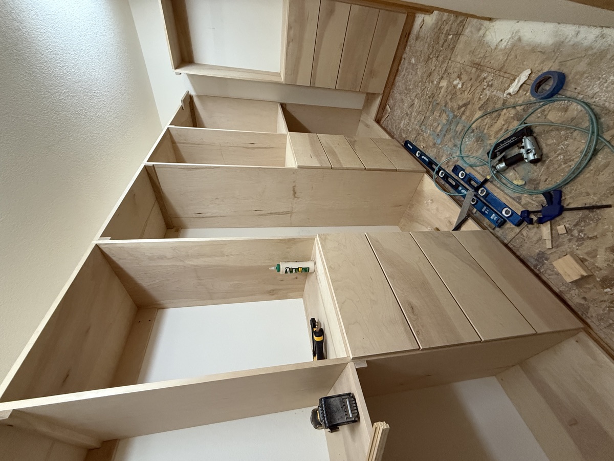 Built-in shelving anchored to studs in the walk-in closet
