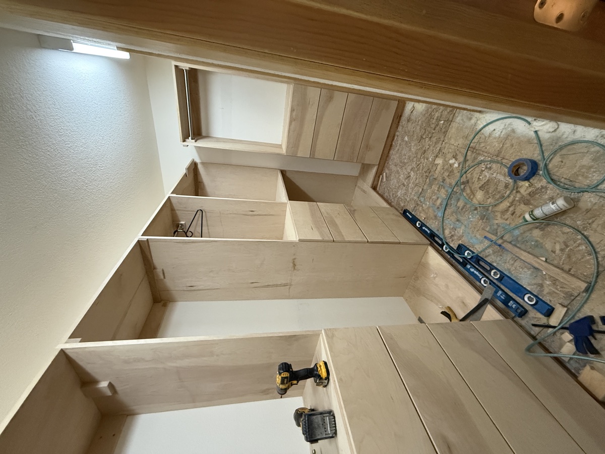 Completed walk-in closet with all towers installed and hardware set