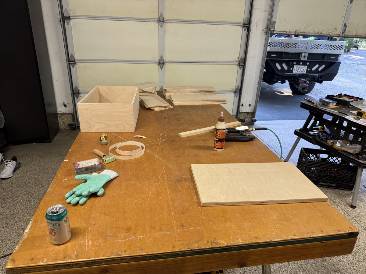 Cabinet boxes being built on workbench from plywood